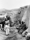 Palestine: A Palestinian family outside their simple vilage home, c. 1910